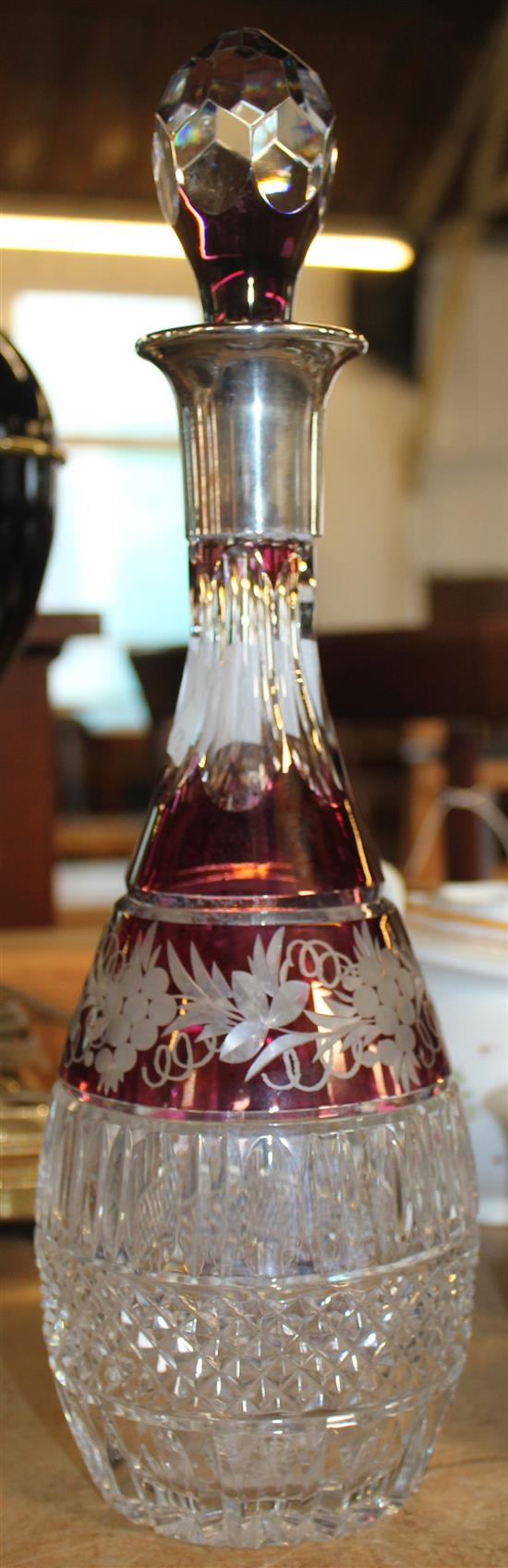 Silver mounted red glass cut decanter